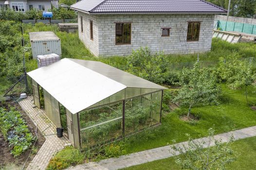 dacha with original gazebo artificial pond and greenery