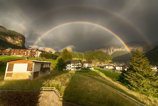 Rainbow after the thunderstorm over the Selva di Val Gardena in a summer end of the day, Trentino-Alto Adige - Italy
