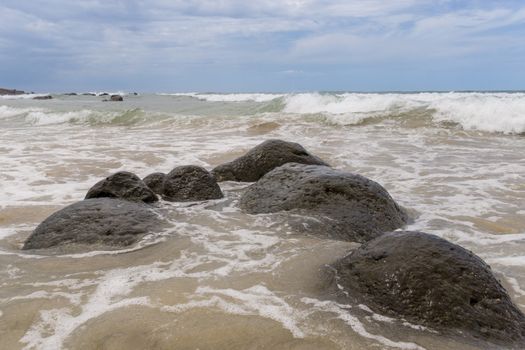 Waves of the Atlantic ocean hitting the beaches along the shores of Dakar, Senegal