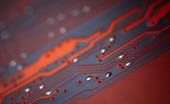 Bokeh electronic circuit close up computer in red colors