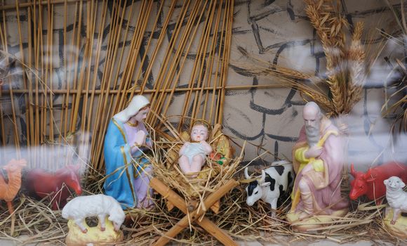 Christmas decor Mary and Joseph near the infant Jesus in the manger.