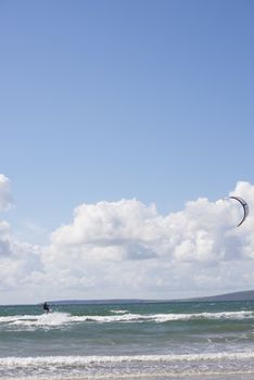 extreme kite surfer on beautiful waves at beach in ballybunion county kerry ireland on the wild atlantic way