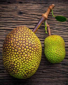 Sweet Jack fruit on shabby wooden background .Tropical fruit  sweet and aromatic flesh of a ripe jack fruit ('Artocarpus heterophyllus') tempts buyers at a tropical fruit stall in Koh Samui ,Thailand.