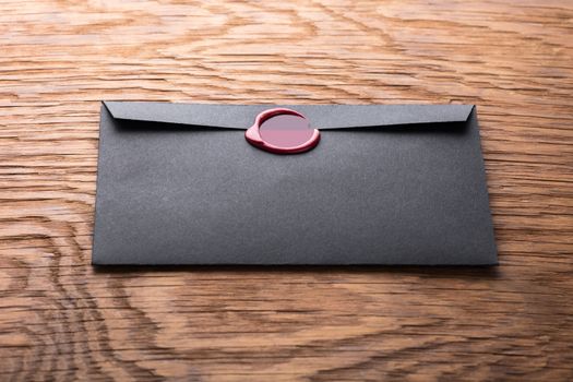 envelope with a stamp on the wooden background