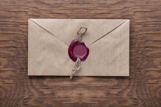 envelope with a stamp on the wooden background