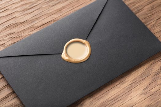 envelope with a stamp on the wooden background