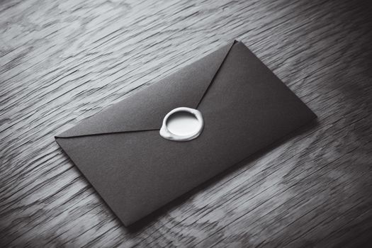 envelope with a stamp on the wooden background