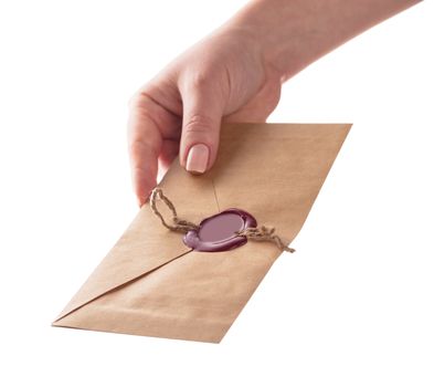 envelope in the hand on a white background isolated