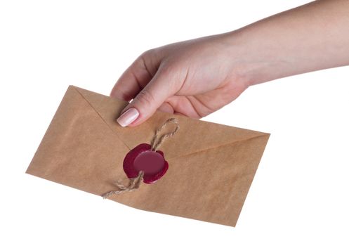 envelope in the hand on a white background isolated