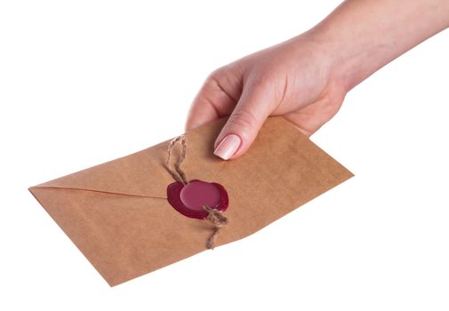 envelope in the hand on a white background isolated