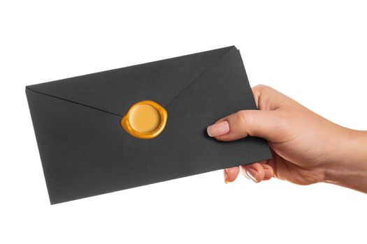 envelope in the hand on a white background isolated