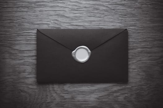 envelope with a stamp on the wooden background
