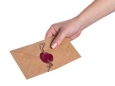 envelope in the hand on a white background isolated