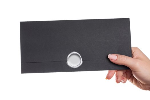 envelope in the hand on a white background isolated