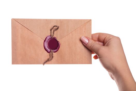 envelope in the hand on a white background isolated