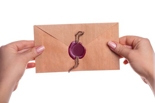 envelope in the hands on a white background isolated