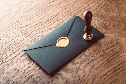 envelope with a stamp on the wooden background