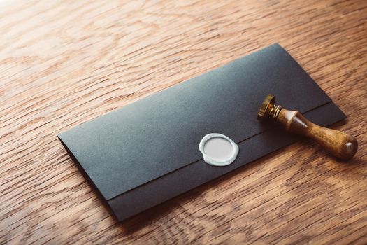 envelope with a stamp on the wooden background