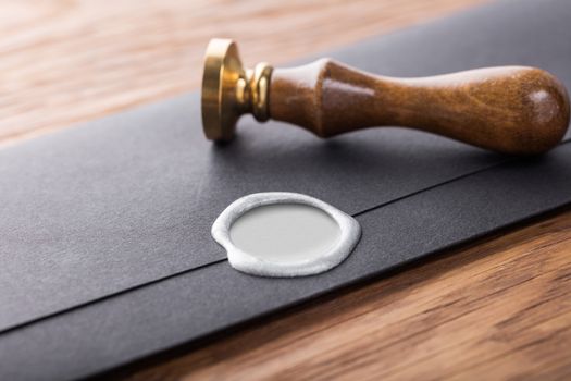 envelope with a stamp on the wooden background