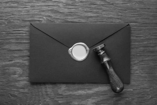 envelope with a stamp on the wooden background