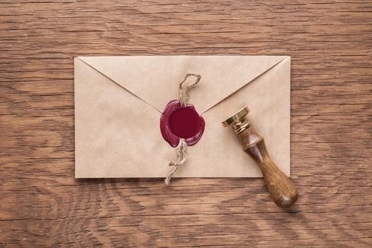 envelope with a stamp on the wooden background