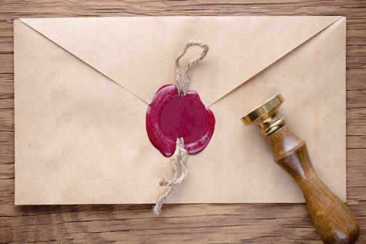 envelope with a stamp on the wooden background