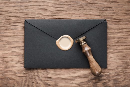 envelope with a stamp on the wooden background