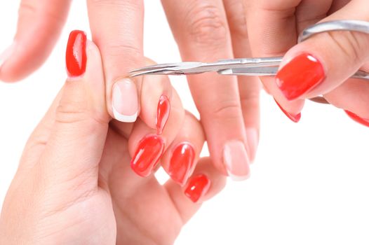 Nail salon, hands beauty treatment, cuticles cutting with cuticle pusher