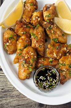 Fried chicken wings in ginger garlic marinade with herbs