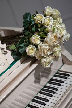 Bouquet of roses on the grand piano