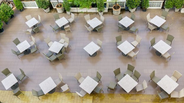Outdoor top view of the empty chairs and table.