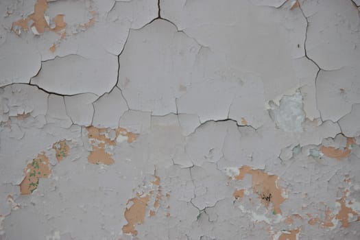 old cracked damaged plaster wall background