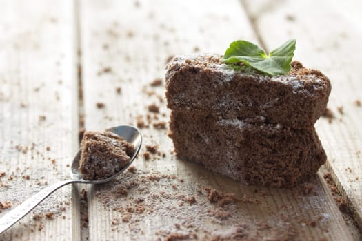 chocolate brownie and mint on wooden table