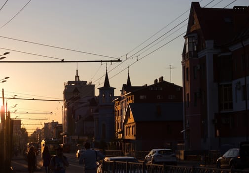 sunset on the street with traffic, ancient city