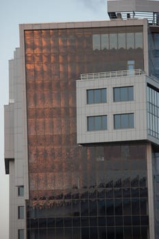 modern office building detail, sun reflection in windows