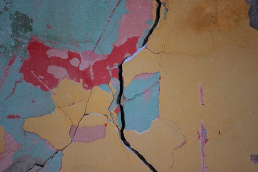 cracked colorful bright old wall close up