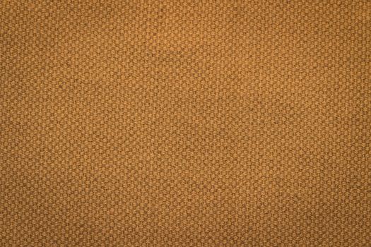 Rustic canvas fabric texture in orange color.