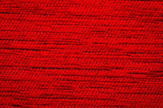 Rustic canvas fabric texture in red color.