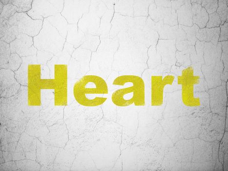 Health concept: Yellow Heart on textured concrete wall background
