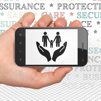 Insurance concept: Hand Holding Smartphone with  black Family And Palm icon on display,  Tag Cloud background, 3D rendering