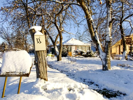 Little Winter Garden with House, Sogn and Post Box in the Countryside of Panevezys City in Lithuania