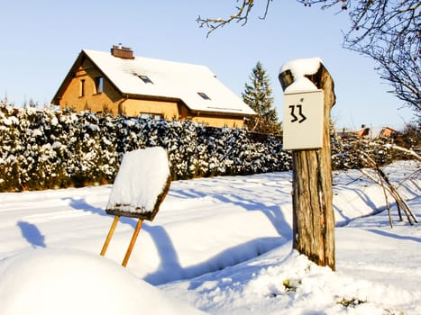 Winter Garden with House, Sogn and Post Box in the Countryside of Panevezys City in Lithuania