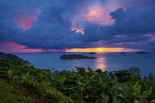 raining over blue sea at  sunset time koh chang island trad eastern thailand