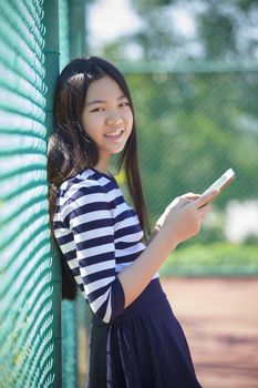 asian teen age and computer tablet in hand 