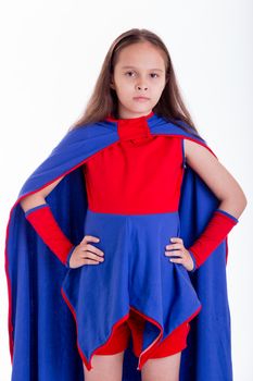 Girl in blue and red superhero costume with hands on hips