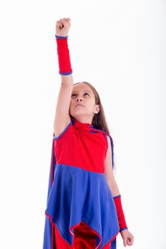 Girl in blue and red superhero costume holding arm up