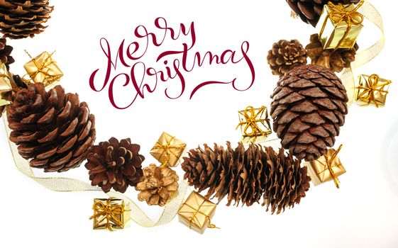 frame of the cones and gifts on white background with text Merry Christmas. Lettering calligraphy.