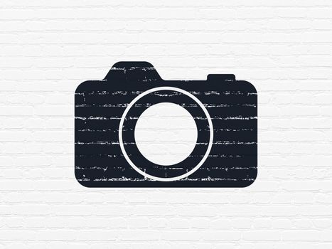 Tourism concept: Painted black Photo Camera icon on White Brick wall background