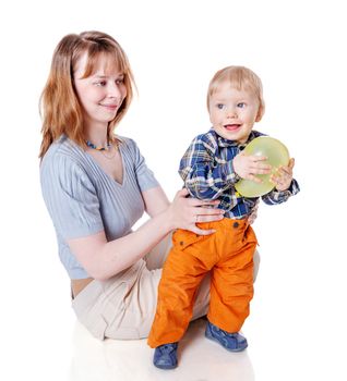 Mother with son playing balloon isolated on white