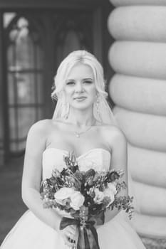 Black and White Photo stylish bride bride with a bouquet of flowers